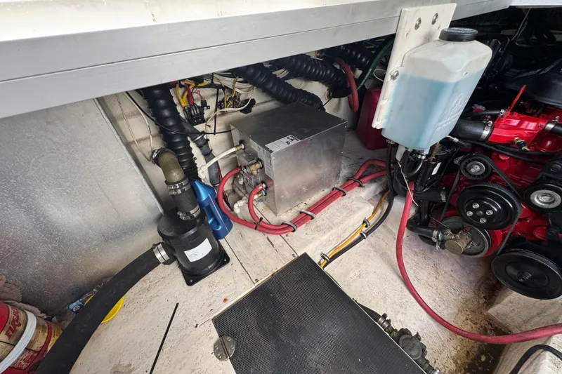 Engine compartment of a 2006 Chaparral Signature 350 boat, showing mechanical components and wiring.
