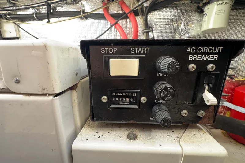 Control panel of a 2006 Chaparral Signature 350 boat with circuit breaker and hour meter.