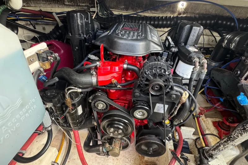 Engine compartment of a 2006 Chaparral Signature 350 boat, featuring a detailed view of the engine.