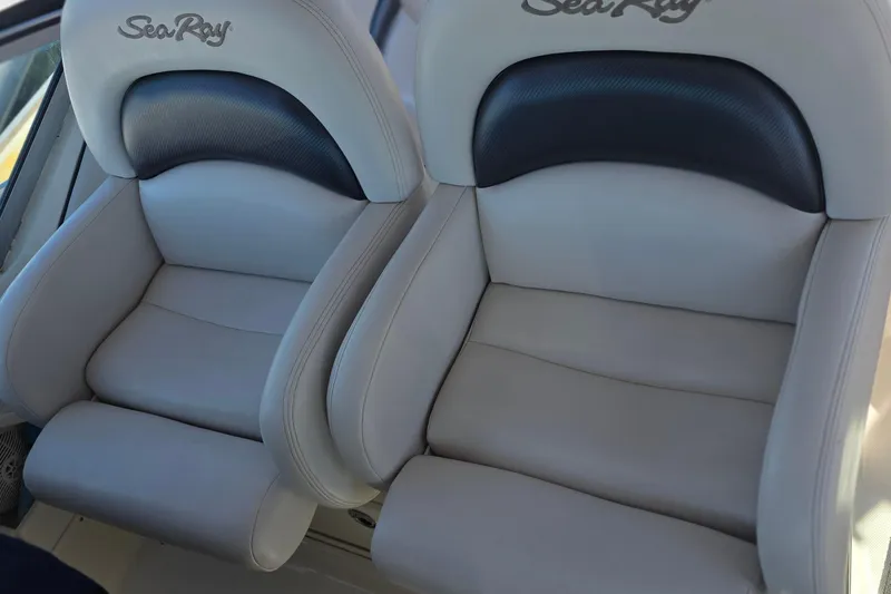 Luxury seating on a 2005 Sea Ray 340 Sundancer boat, featuring plush leather upholstery.