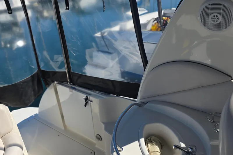 Interior view of 2005 Sea Ray 340 Sundancer boat with seating and sink.