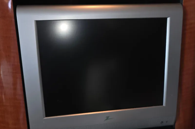 Flat screen TV on 2005 Sea Ray 340 Sundancer yacht interior.