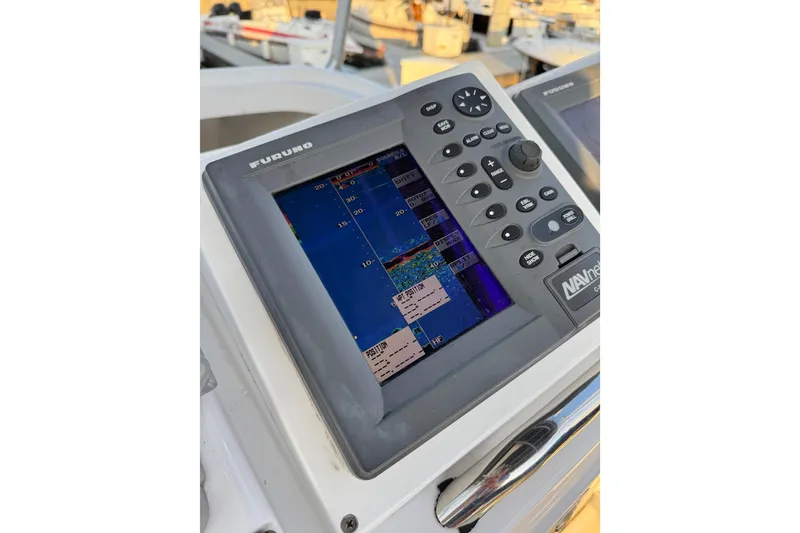 Furuno navigation system on 1998 Luhrs Tournament 320 Convertible boat dashboard.