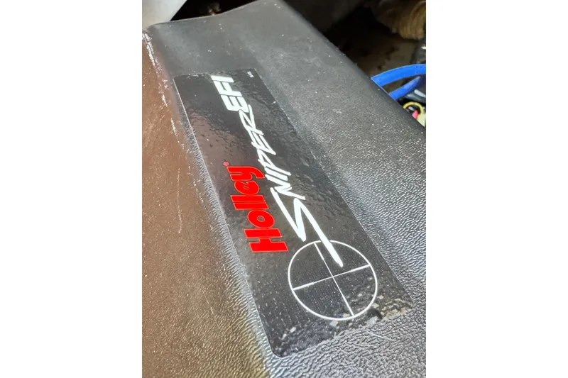Sticker on a 1998 Luhrs Tournament 320 Convertible featuring Holley Sniper EFI logo.