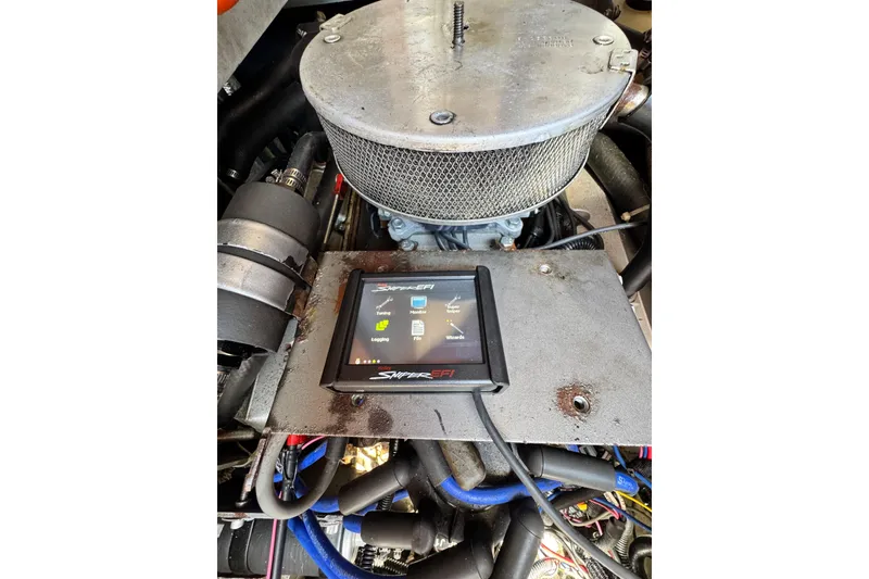 Engine compartment of a 1998 Luhrs Tournament 320 Convertible with Sniper EFI system.