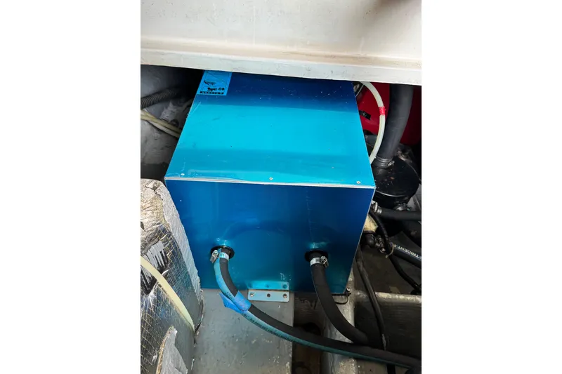Engine compartment of 1998 Luhrs Tournament 320 Convertible with blue machinery.