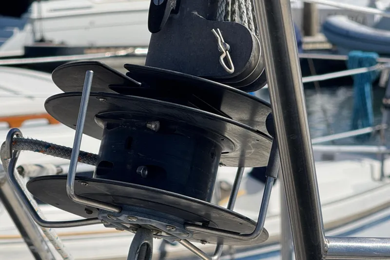 Close-up of a 1988 Gulf Pilot House sailboat winch mechanism at a marina.