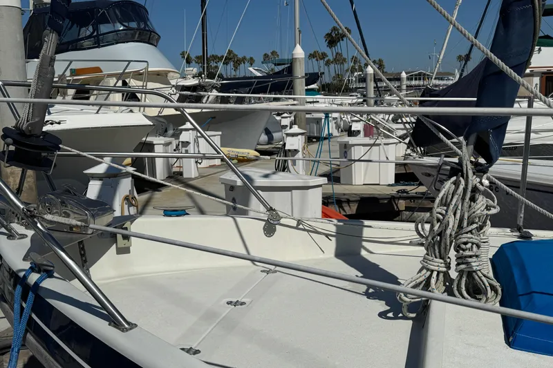 1988 Gulf Pilot House sailboat docked at marina with rigging and ropes.