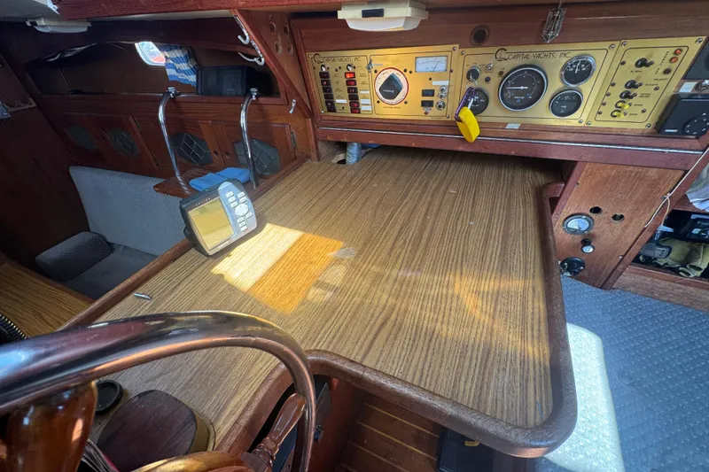 1988 Gulf Pilot House interior with navigation instruments and wooden dashboard.