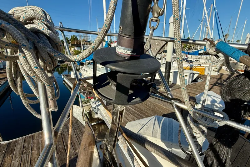 1981 Mariner Mayflower sailboat deck with ropes and winch at marina.
