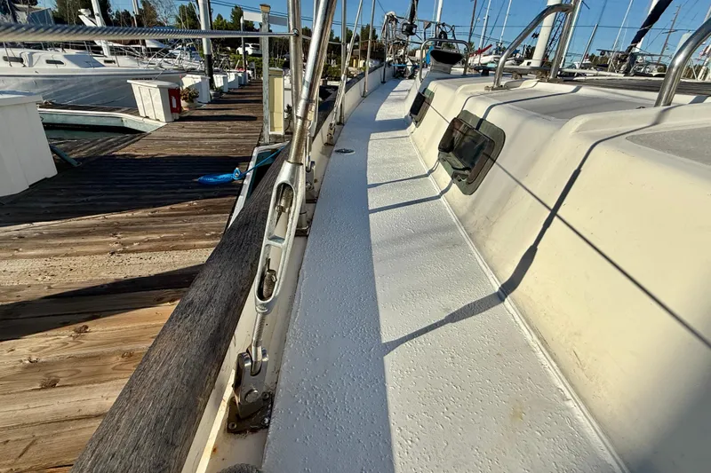 1981 Mariner Mayflower yacht deck at marina, showcasing sleek design and sturdy construction.