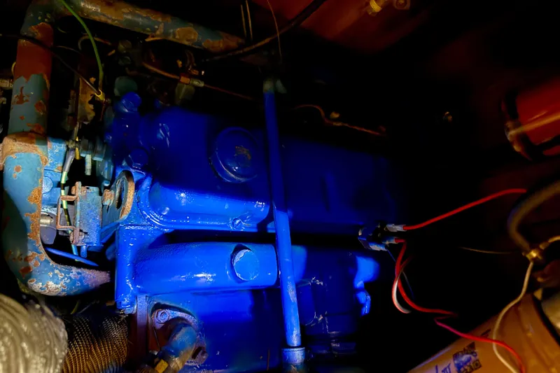Blue engine of 1981 Mariner Mayflower with visible wiring and components.