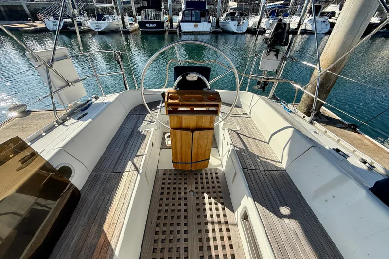 Cockpit of 1988 Beneteau Oceanis 390 sailboat docked at marina.