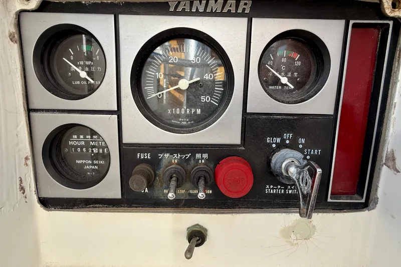 Control panel of a 1988 Beneteau Oceanis 390 sailboat with Yanmar engine gauges.