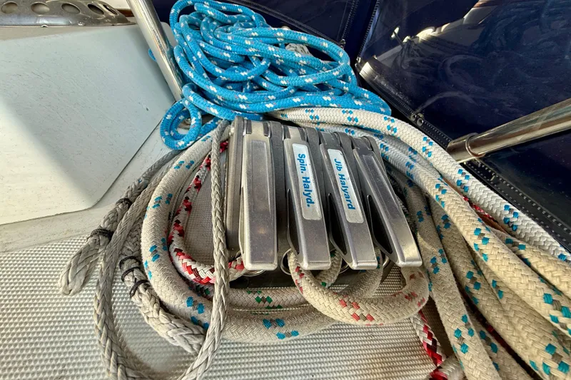 Ropes and cleats on a 1988 Beneteau Oceanis 390 sailboat deck.
