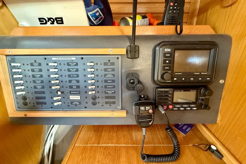Control panel of a 1988 Beneteau Oceanis 390 sailboat with navigation and communication equipment.