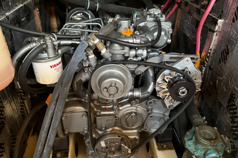 Engine compartment of a 1988 Beneteau Oceanis 390 sailboat, featuring a Yanmar engine.