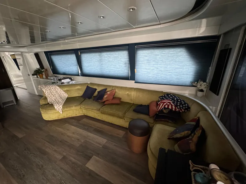 Luxurious interior of 1990 Versilcraft Challenger Motor Yacht with plush seating and modern decor.