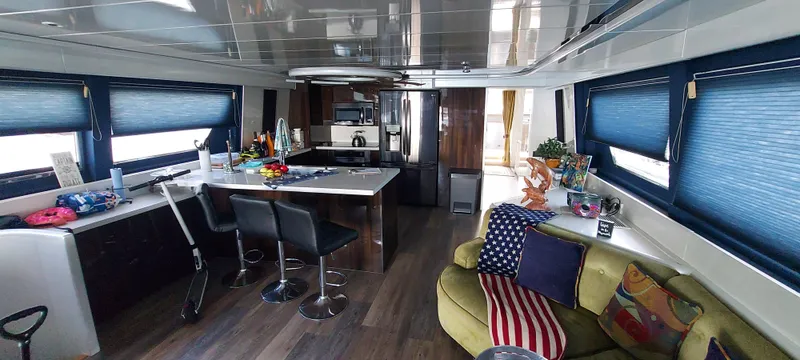 Luxurious interior of 1990 Versilcraft Challenger Motor Yacht with modern kitchen and seating area.