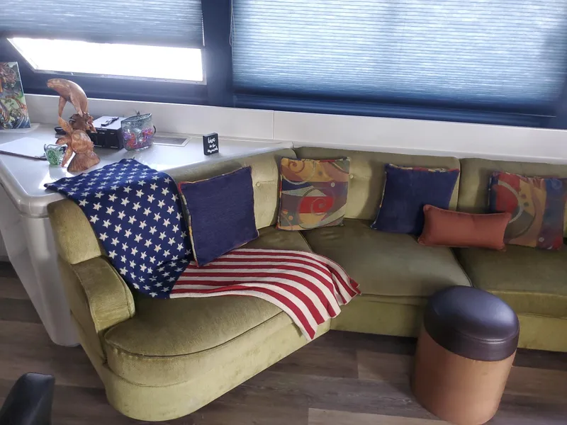 Luxurious Versilcraft Challenger Motor Yacht 1990 interior with cozy seating and decorative pillows.