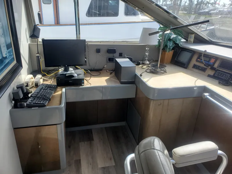 Control room of a 1990 Versilcraft Challenger Motor Yacht with computer and navigation equipment.