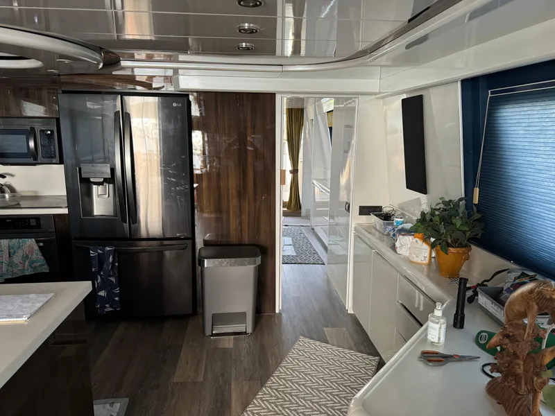 Interior of 1990 Versilcraft Challenger Motor Yacht with modern kitchen amenities.