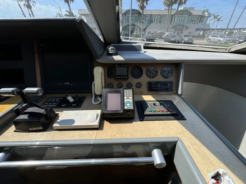 Control panel of a 1990 Versilcraft Challenger Motor Yacht with navigation instruments.