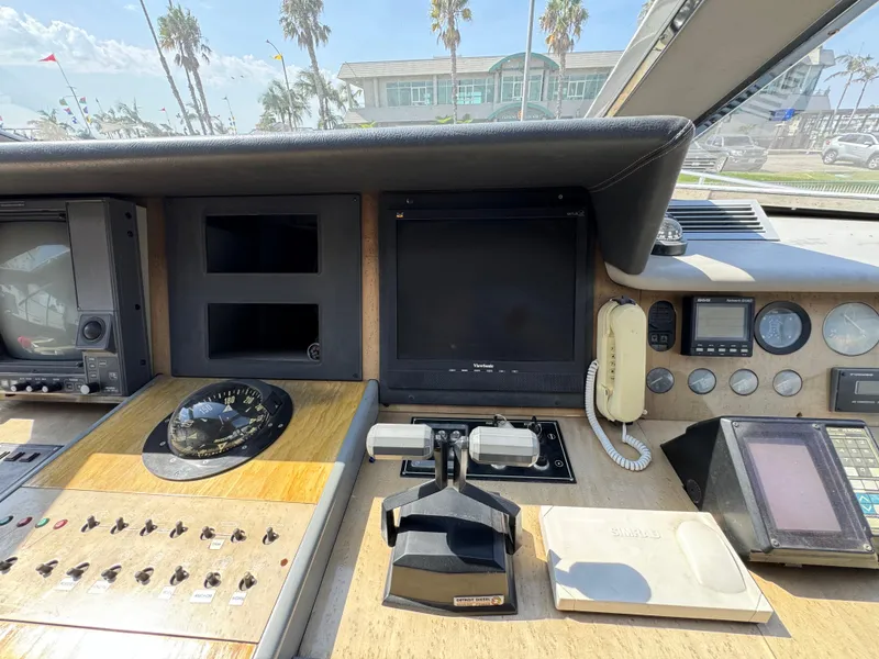 Control panel of a 1990 Versilcraft Challenger Motor Yacht with navigation instruments.