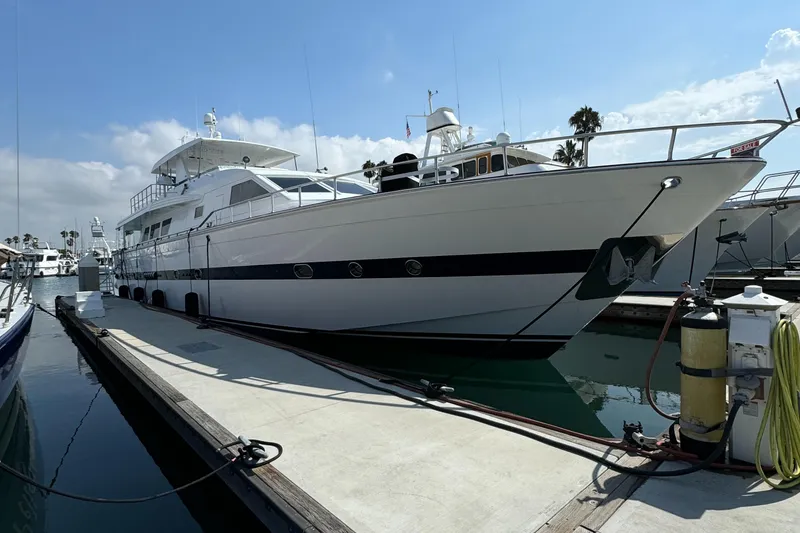 1990 Versilcraft Challenger Motor Yacht docked at marina under clear sky.