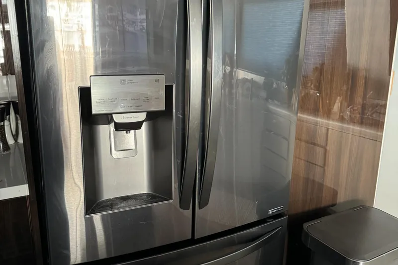 Stainless steel refrigerator in 1990 Versilcraft Challenger Motor Yacht kitchen.