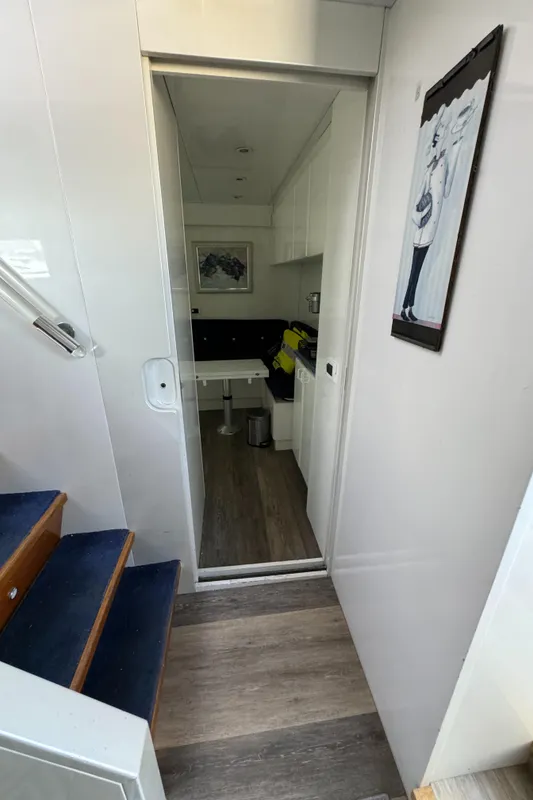 Interior of 1990 Versilcraft Challenger Motor Yacht with modern decor and staircase.
