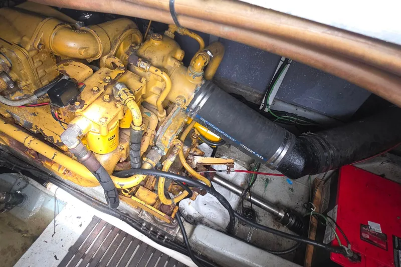 Engine compartment of a 1988 Sea Ray 460 Express Cruiser, showcasing mechanical components.