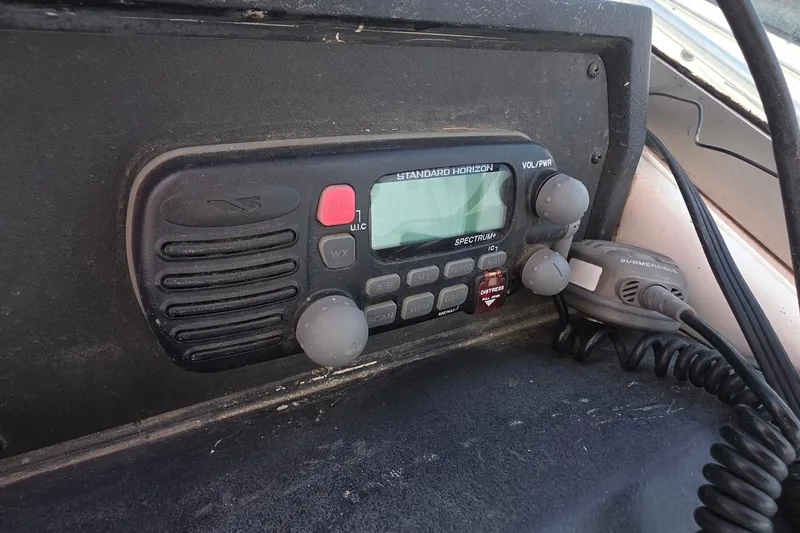 VHF radio on 1988 Sea Ray 460 Express Cruiser dashboard, featuring Standard Horizon controls.