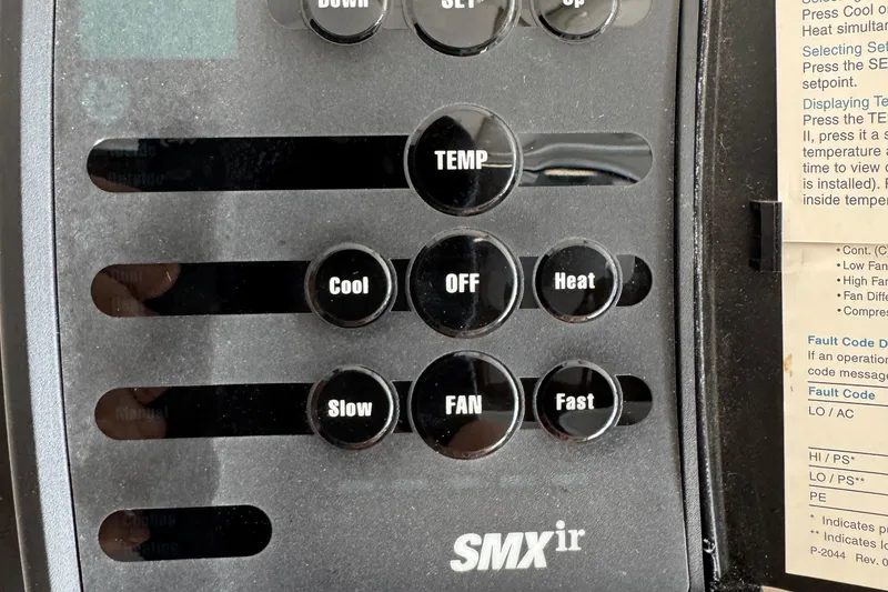 Control panel of a 1984 Blackfin 32 Flybridge boat with temperature settings.
