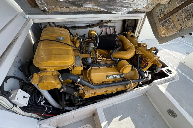 Engine compartment of a 1984 Blackfin 32 Flybridge with a Caterpillar engine.