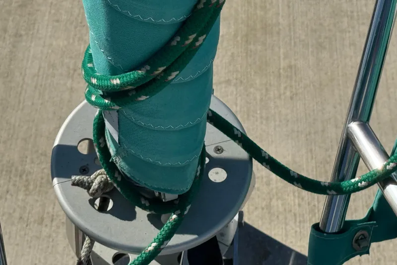 Close-up of Catalina 36 MkII sailboat rigging, featuring green ropes and sail, 1997 model.