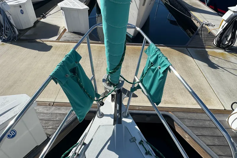 Bow of a 1997 Catalina 36 MkII sailboat docked at a marina.