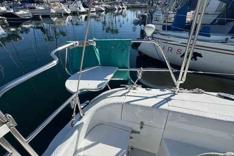 Sailboat stern view of 1997 Catalina 36 MkII docked in marina.