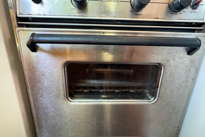 Stainless steel oven with black handle on a 1997 Catalina 36 MkII yacht.