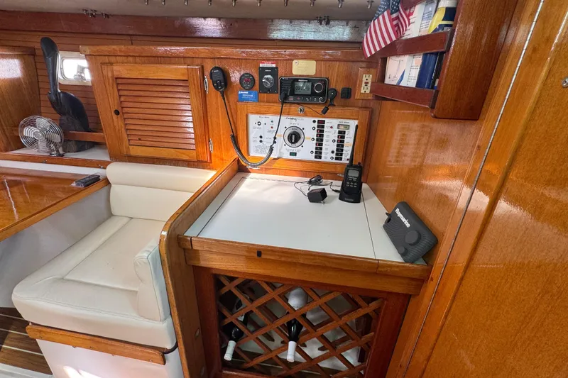 Interior of 1997 Catalina 36 MkII sailboat with navigation equipment and wooden cabinetry.