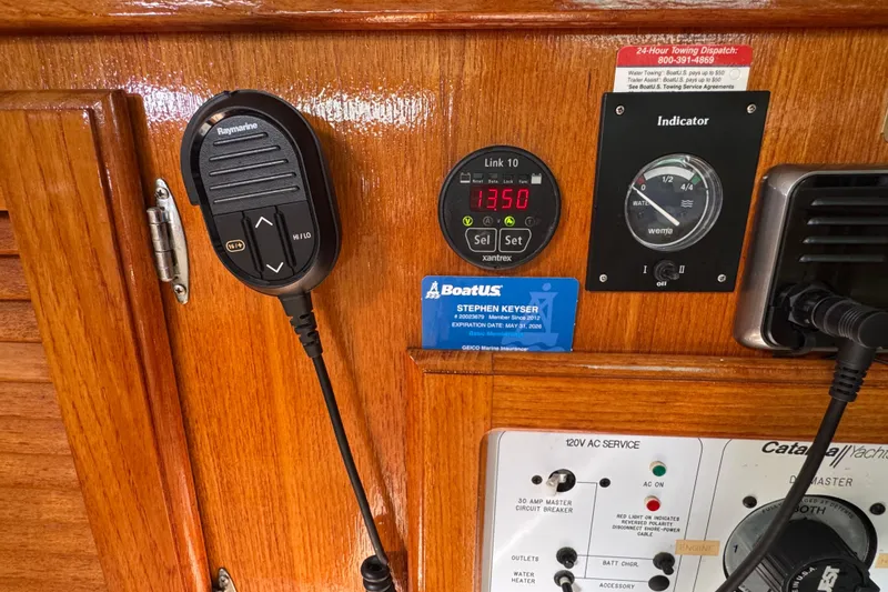 Control panel of a 1997 Catalina 36 MkII sailboat with various instruments and a microphone.