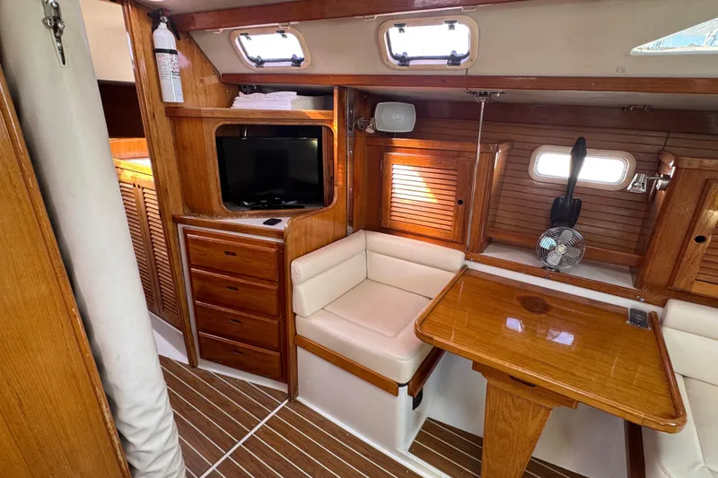 Interior of a 1997 Catalina 36 MkII sailboat with wood finish and seating area.