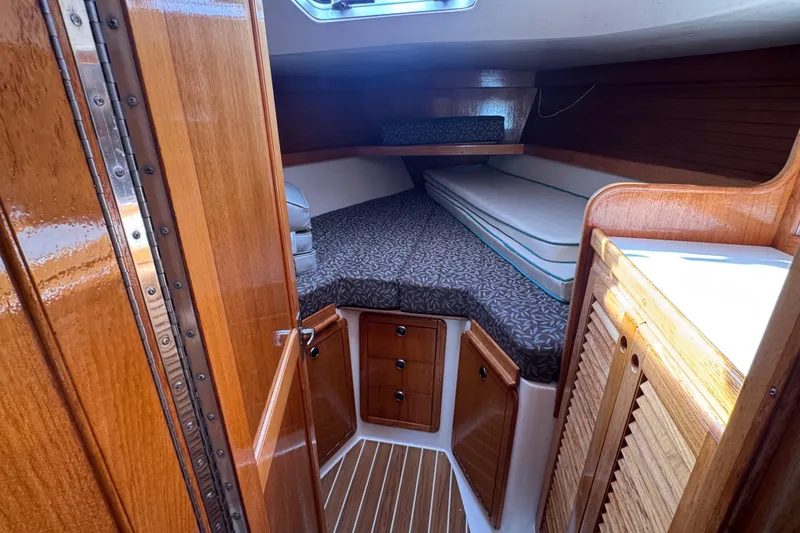 Cozy cabin interior of 1997 Catalina 36 MkII sailboat with wooden finishes.