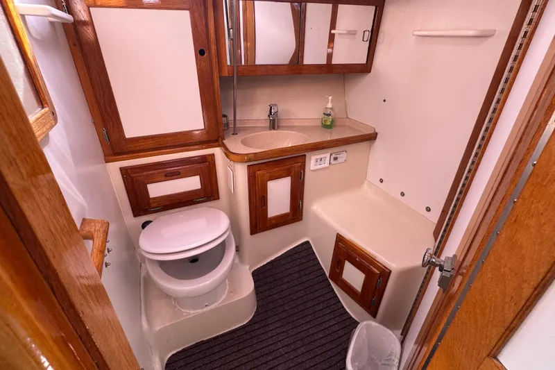 1997 Catalina 36 MkII yacht bathroom with wooden cabinets and modern fixtures.