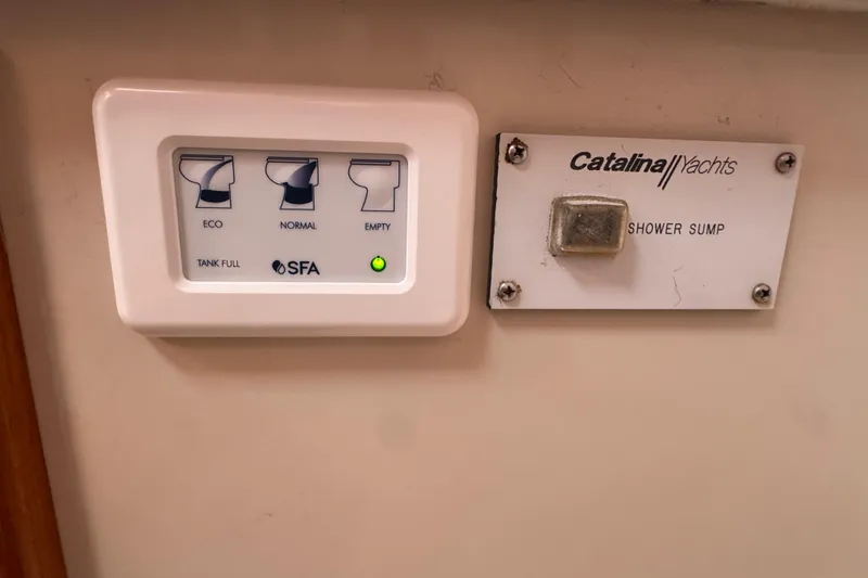 Control panel on a 1997 Catalina 36 MkII yacht, featuring eco, normal, and empty settings.