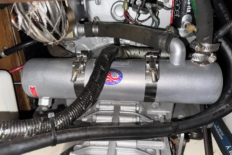 Engine compartment of a 1997 Catalina 36 MkII sailboat, featuring mechanical components and wiring.