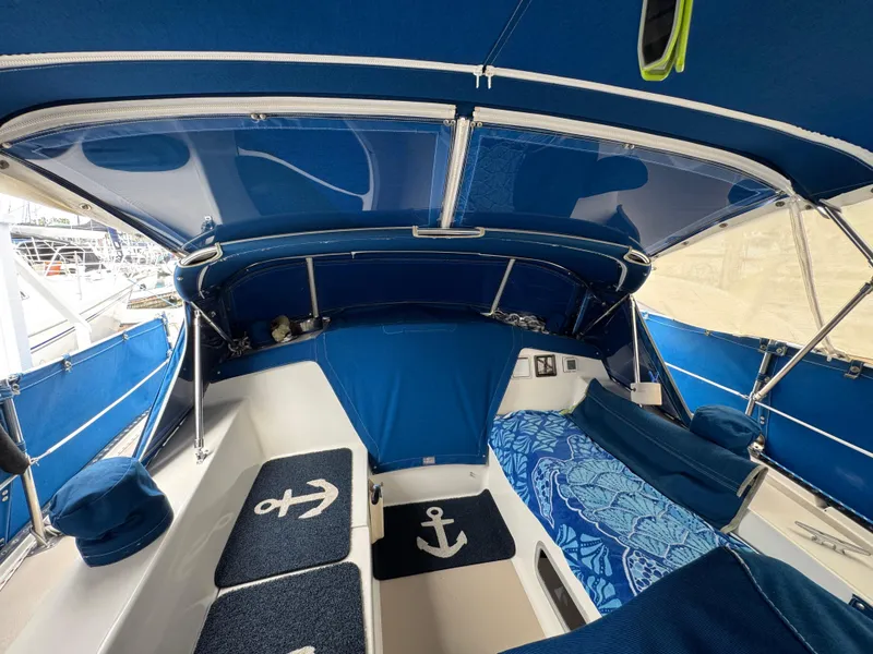 Interior view of a 1985 Catalina 36 MK1 sailboat with blue nautical decor.