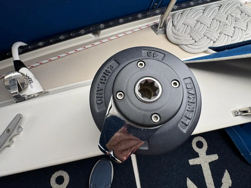 Winch on 1985 Catalina 36 MK1 sailboat deck with nautical decor.