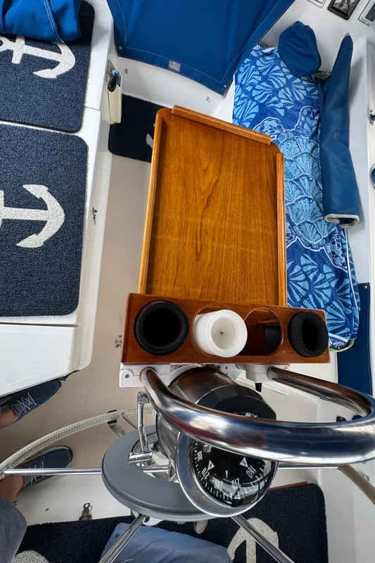 Interior of 1985 Catalina 36 MK1 sailboat with wooden table and nautical-themed decor.