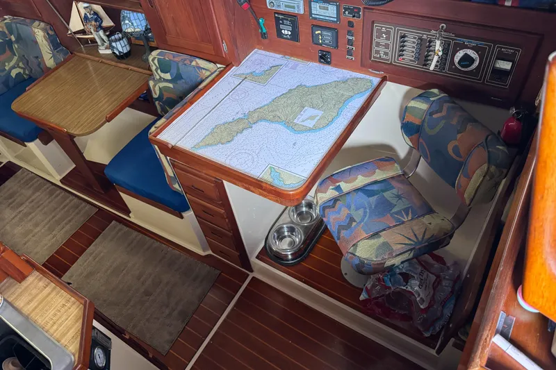 Interior of 1985 Catalina 36 MK1 sailboat with navigation station and seating area.